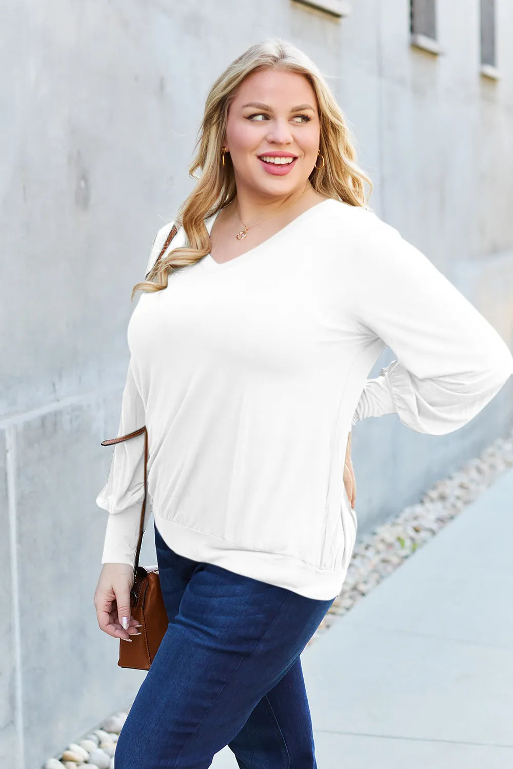 Sky blue Trendsi Basic Bae V-Neck Lantern Sleeve Top shown on a model, featuring a relaxed fit and stylish lantern sleeves.