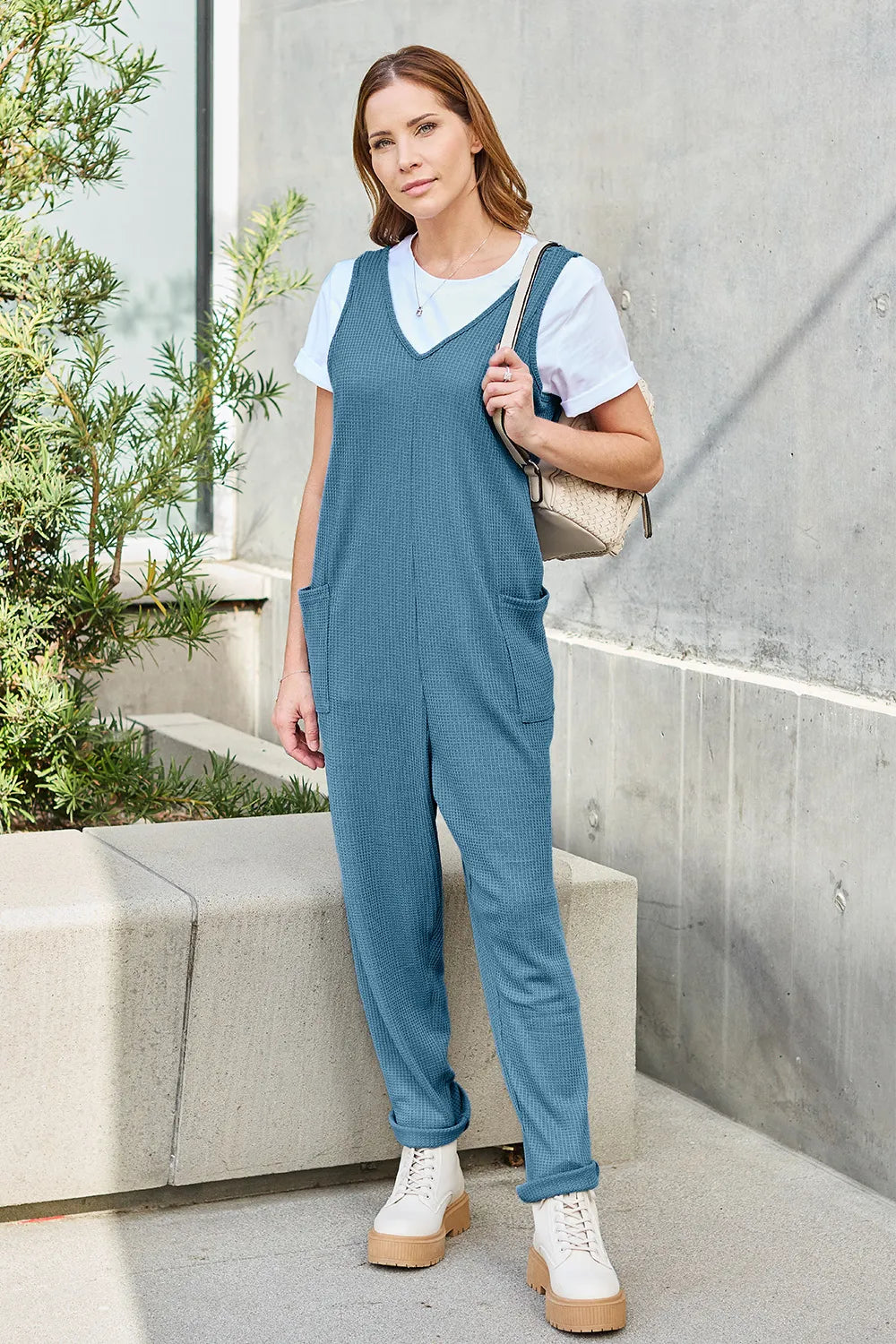 Sky blue sleeveless straight jumpsuit by Trendsi, featuring a full-size, casual fit with a sleek, modern design.