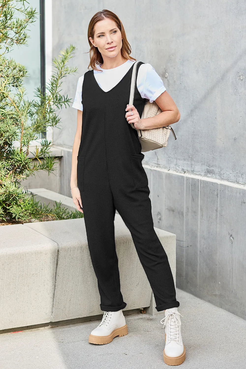 Sky blue Trendsi Double Take full-size sleeveless straight jumpsuit displayed on a model with a fitted waist and wide-leg design.