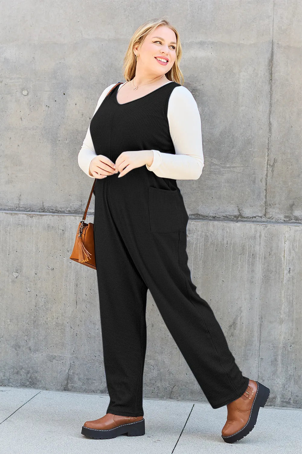 Sky-blue Trendsi Double Take sleeveless full-size straight jumpsuit displayed on a model, showcasing its sleek, modern design.