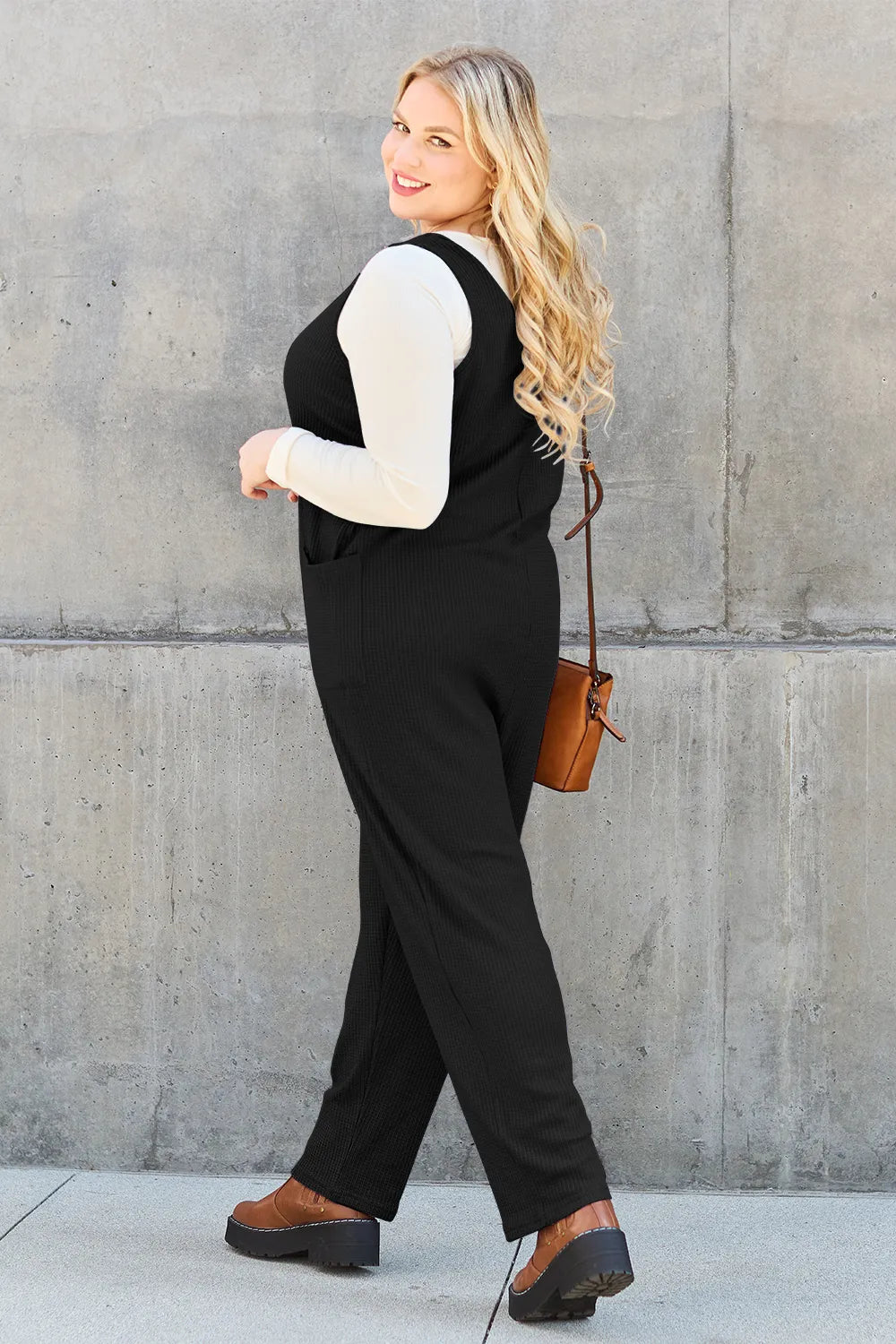 Sky blue Trendsi Double Take sleeveless straight jumpsuit, full size, with a fitted waist and wide-leg design, laid flat.
