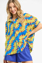 Sky blue Umgee printed button-up relaxed shirt with long sleeves and a casual fit, perfect for everyday wear.