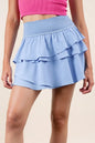 Sky blue Very J riffled tiered layers activewear skirt with built-in shorts, featuring a comfortable and stylish athletic design.