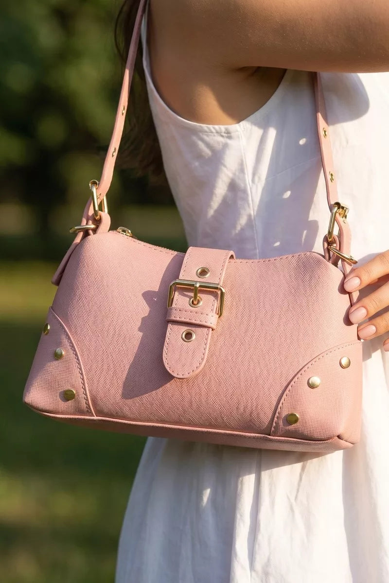 Fame studded saffiano buckle strap shoulder bag by Trendsi, featuring metal studs, a structured design, and a sleek strap.