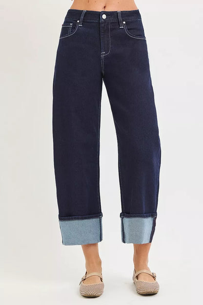 Dark blue RISEN slouchy crop barrel cuff jeans with a relaxed fit and cuffed hem, styled for casual wear.