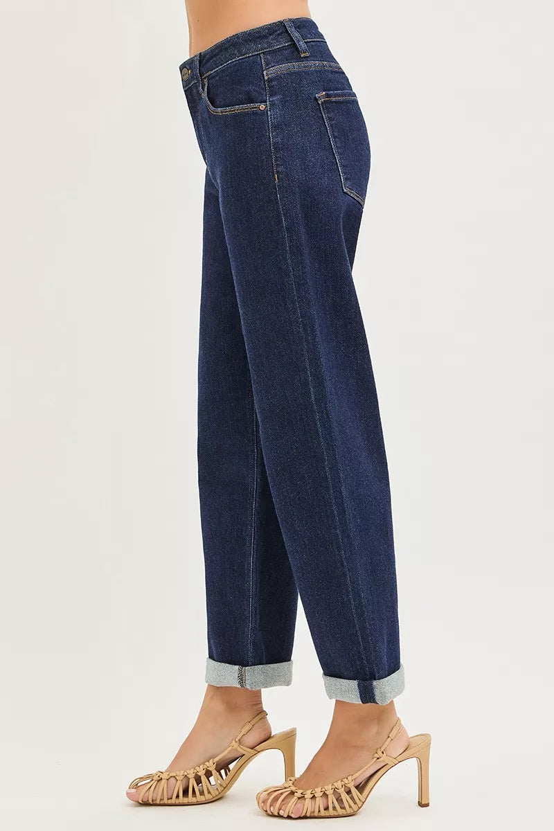 Dark blue RISEN slouchy cropped boyfriend jeans with cuffed hem, casual and relaxed fit, styled with a rolled cuff.