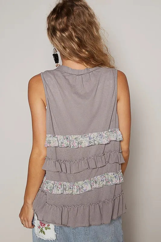 Stone grey ruffled open-front sleeveless cardigan by Trendsi, featuring multicolor accents and a stylish, lightweight design.