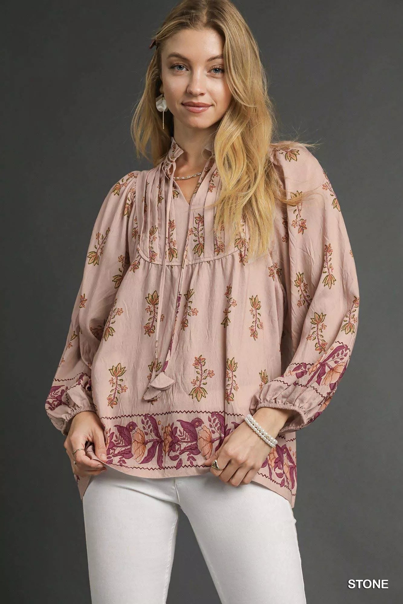 Umgee floral boho peasant blouse with long sleeves and a relaxed fit, featuring a colorful floral pattern and lightweight fabric.