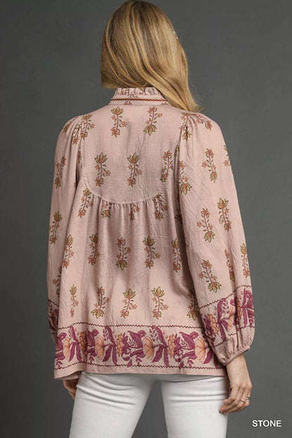 Umgee floral boho peasant blouse featuring a relaxed fit, long sleeves, and a vibrant floral pattern, perfect for casual bohemian style.