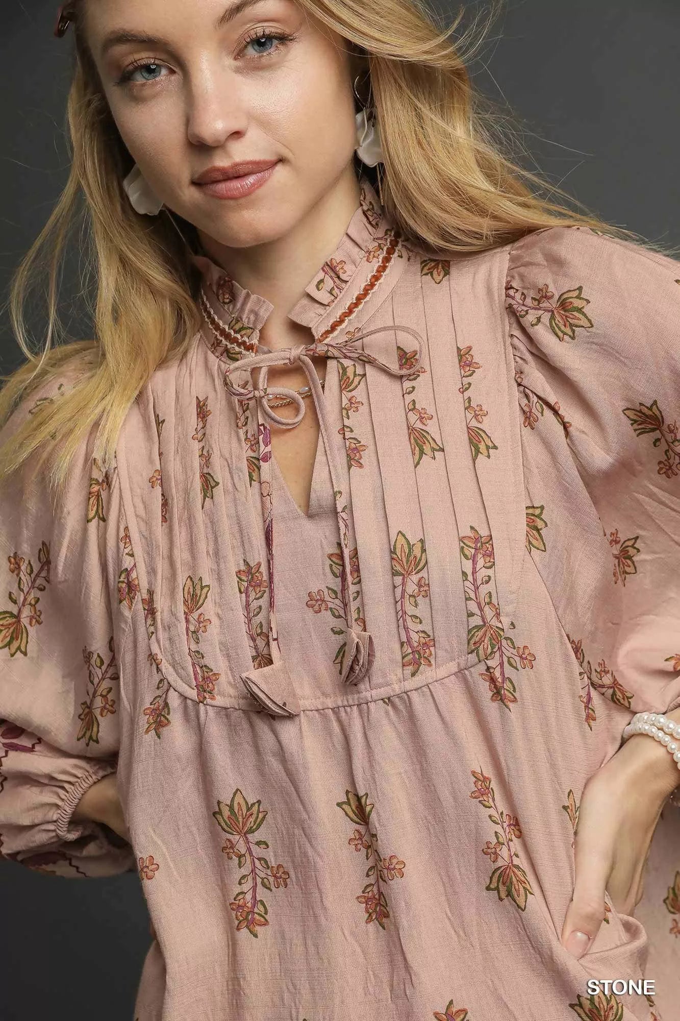 Trendsi Umgee floral boho peasant blouse with long sleeves and a relaxed fit, featuring a vibrant floral pattern.