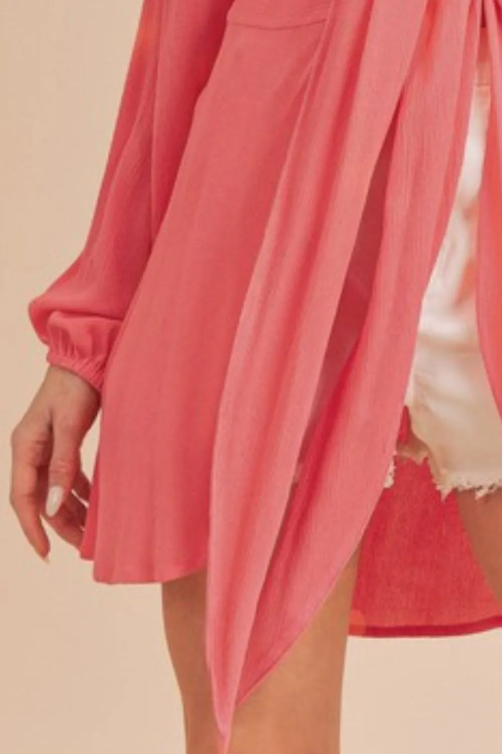Aemi + Co tied collared neck long sleeve top in strawberry red, stylish and fitted, shown on a model.