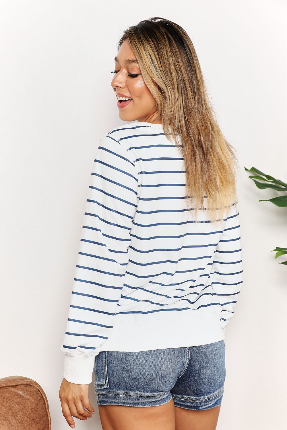 Double Take striped long sleeve round neck top by Trendsi, featuring a stylish multicolor pattern and comfortable fit.