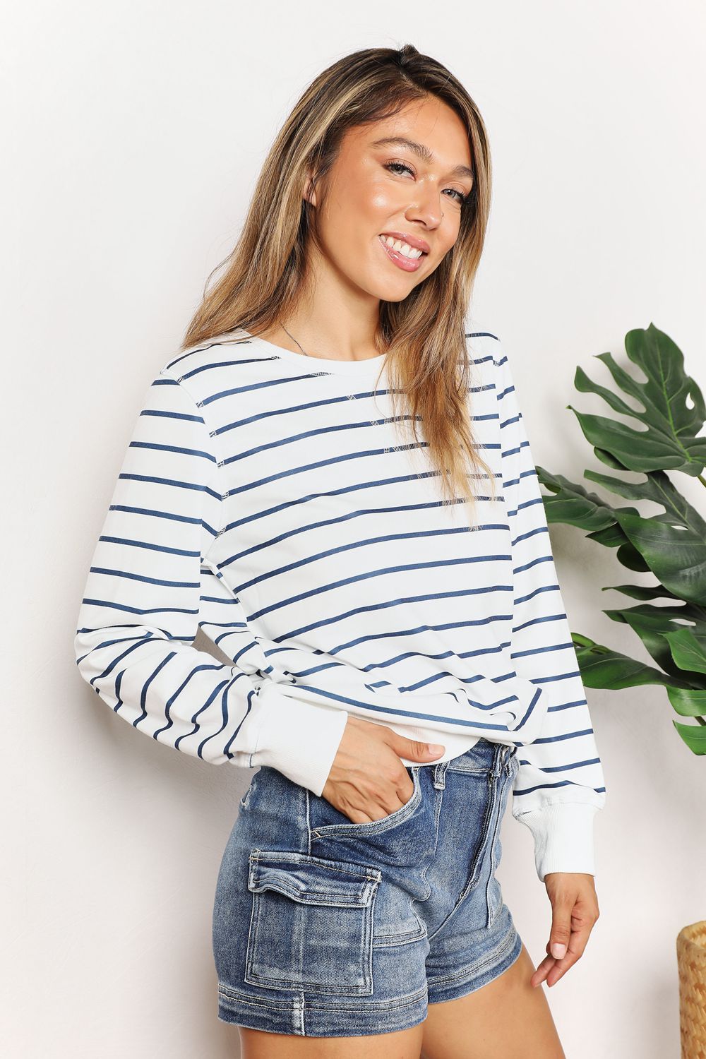Trendsi Double Take striped long sleeve round neck top, featuring bold horizontal black and white stripes, casual and stylish fit.