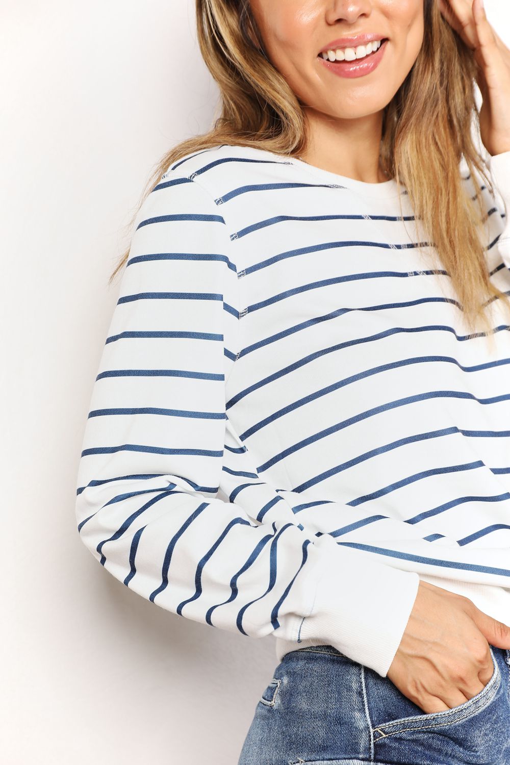 Striped long sleeve round neck top by Trendsi, featuring a classic design with bold horizontal stripes and a comfortable fit.