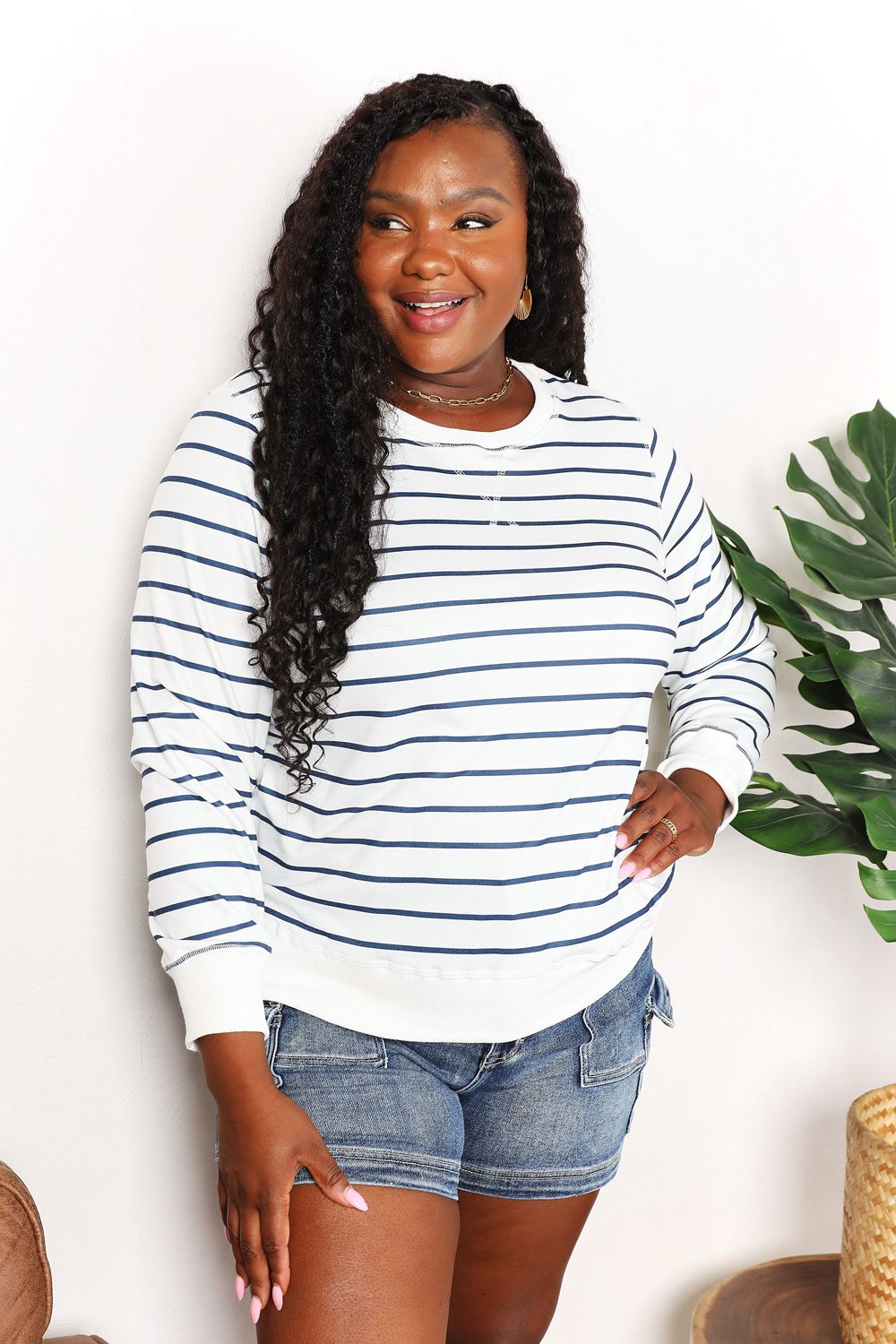 Double Take striped long sleeve round neck top from Trendsi, featuring a fitted design with bold horizontal stripes.