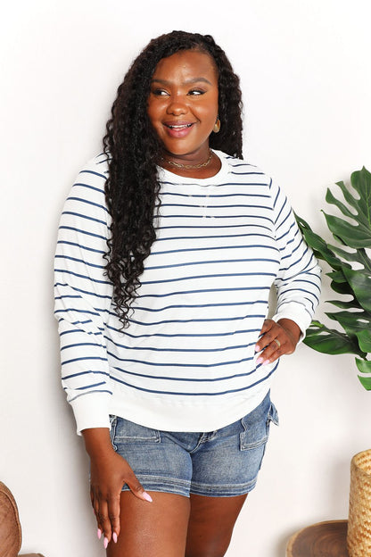 Double Take striped long sleeve round neck top from Trendsi, featuring a fitted design with bold horizontal stripes.