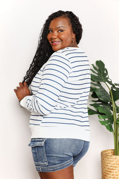 Striped long sleeve round neck top from Trendsi's Double Take collection, featuring a comfortable fit and classic design.