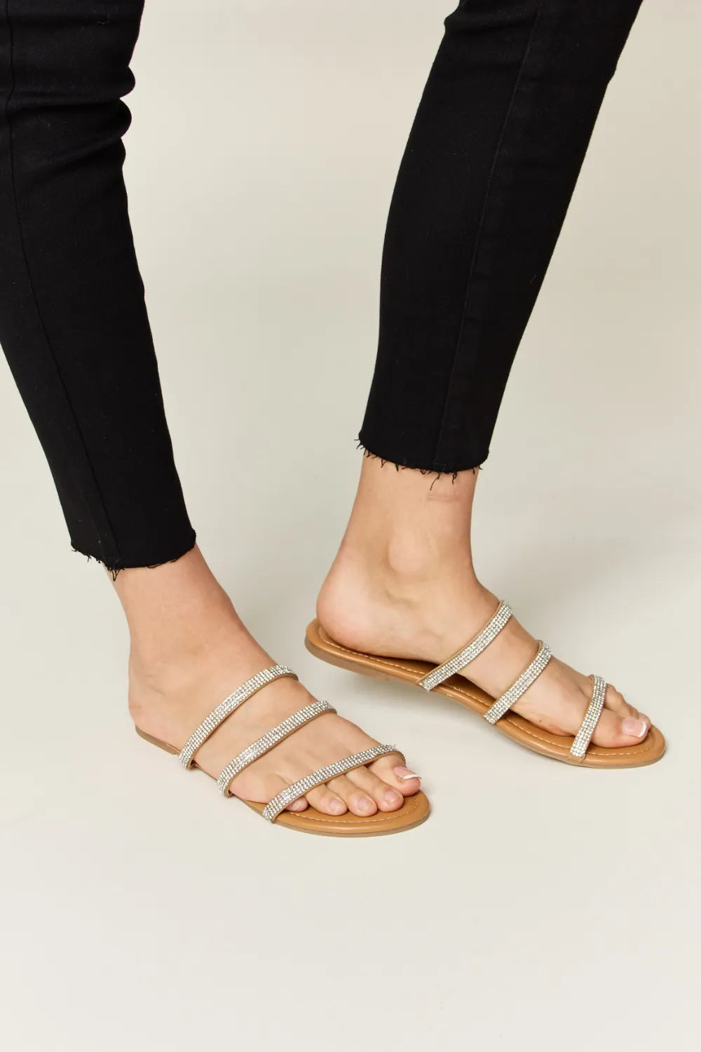 Tan Wild Diva rhinestone three-strap flat sandals with sparkling embellishments and open toe design, perfect for casual summer wear.