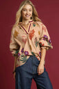 Umgee floral print flounce sleeve blouse in tan and mix colors, shown on a model with a relaxed fit and feminine design.
