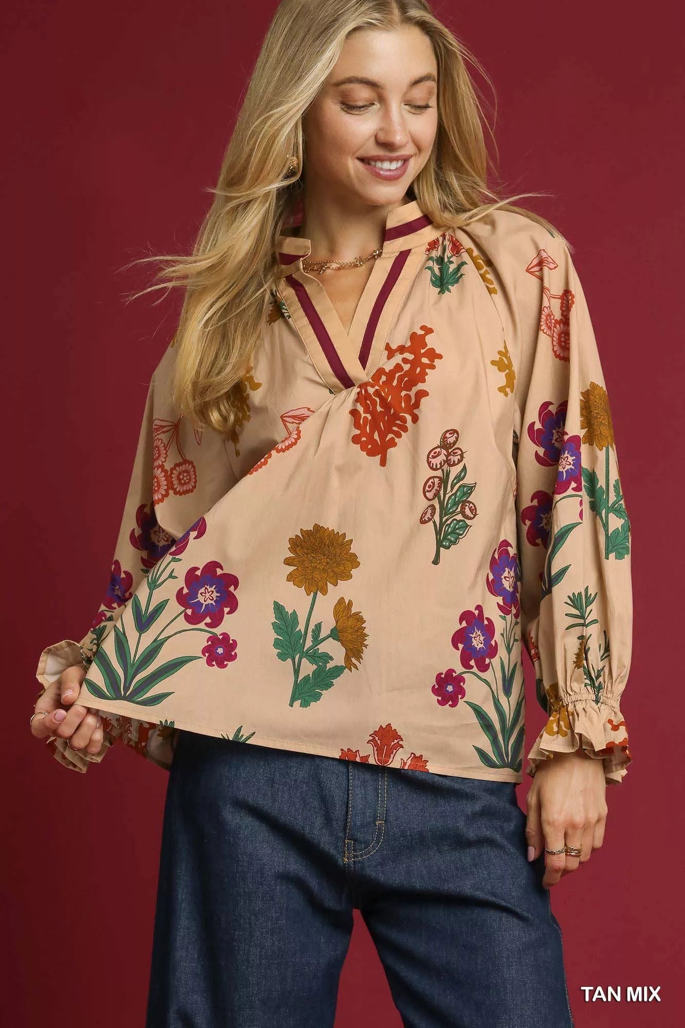 Tan floral print Umgee blouse with flounce sleeves, featuring a feminine and stylish design, perfect for casual or dressy wear.