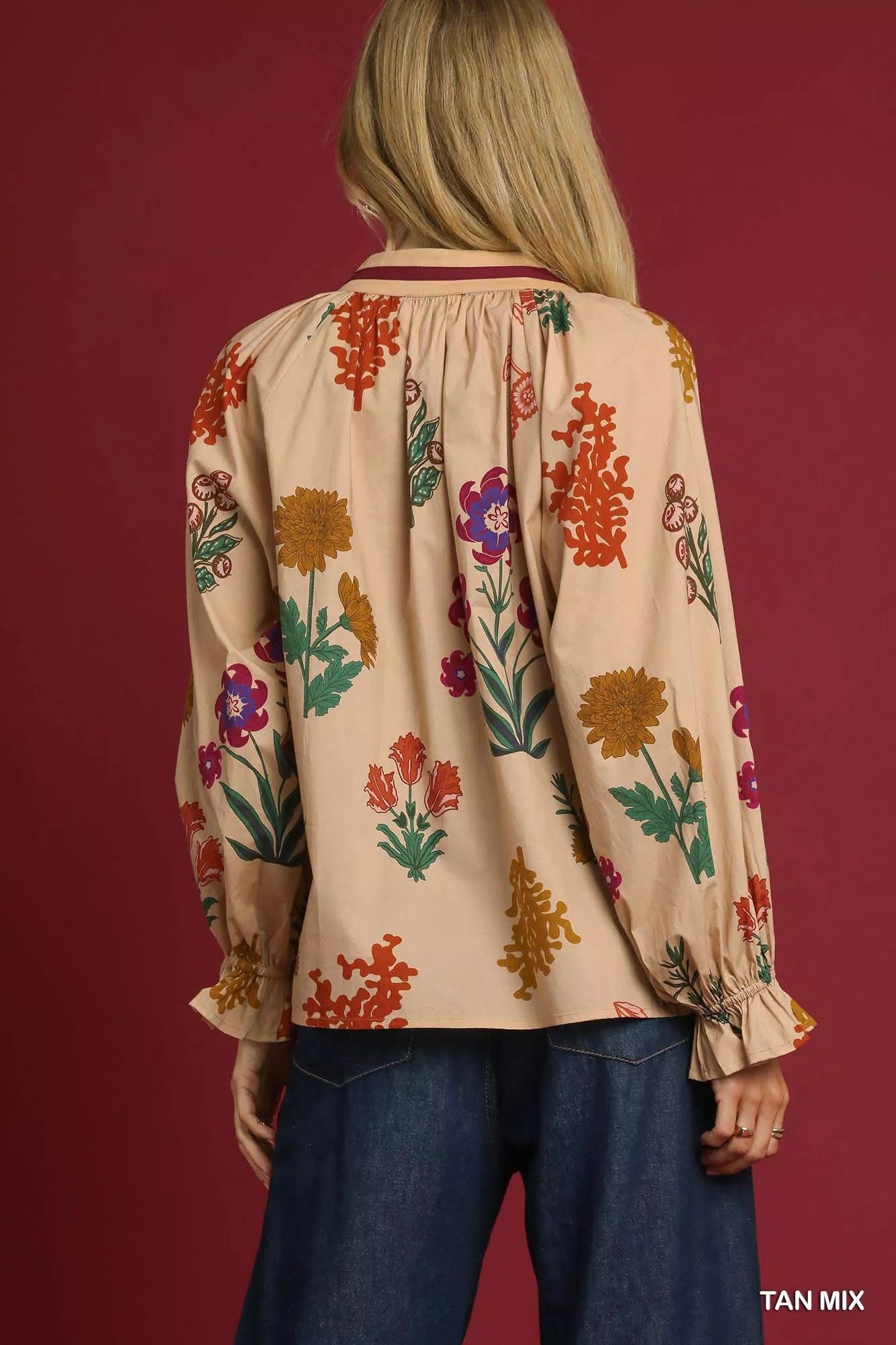 Umgee floral print blouse with flounce sleeves, showcasing a stylish and feminine design in a tan mix pattern.
