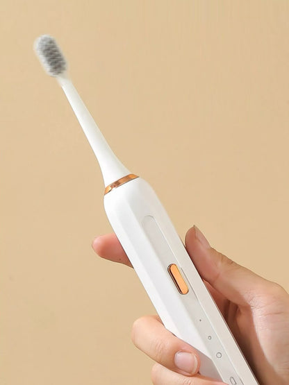 Trendsi smart electric toothbrush with tan handle and brush head, designed for effective at-home dental cleaning.
