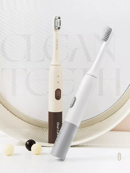 Trendsi rechargeable electric toothbrush with tan handle and one-size design, showing the brush head and sleek modern look.