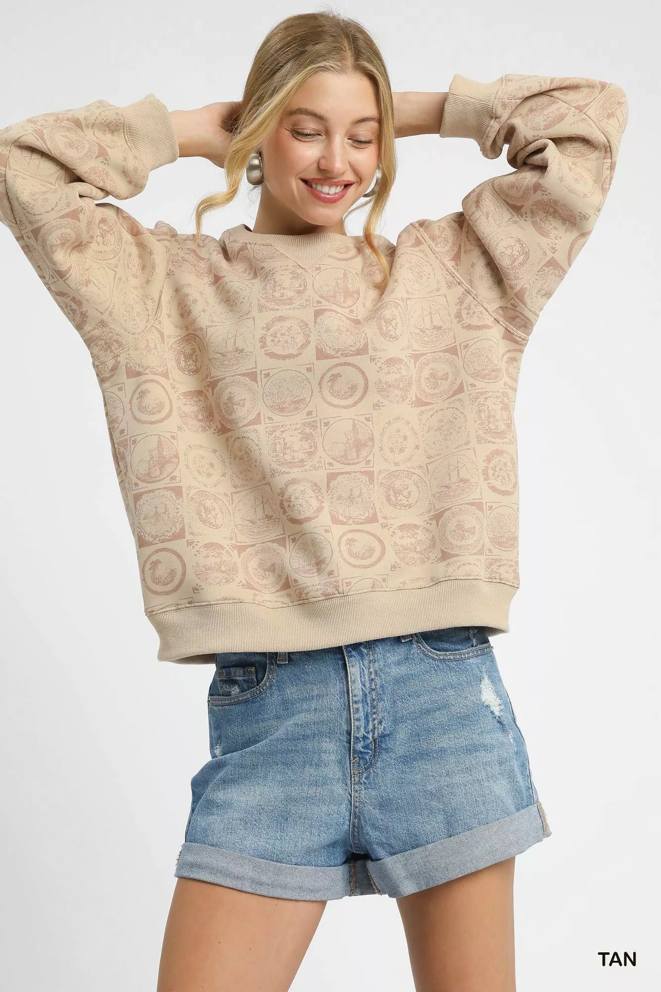 Tan Umgee coin stamp print sweatshirt with a relaxed fit, featuring a casual crewneck design and subtle coin stamp pattern.