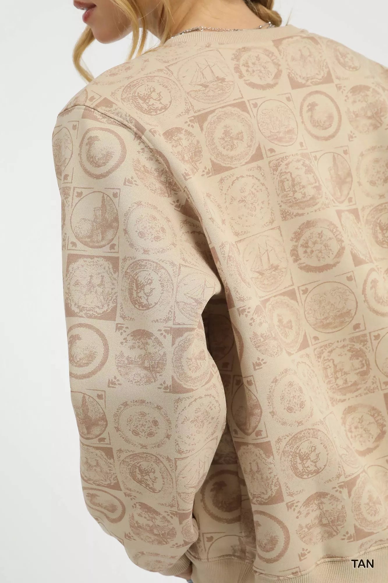 Tan Umgee coin stamp print sweatshirt with a relaxed fit, featuring a vintage-inspired coin design and casual style.