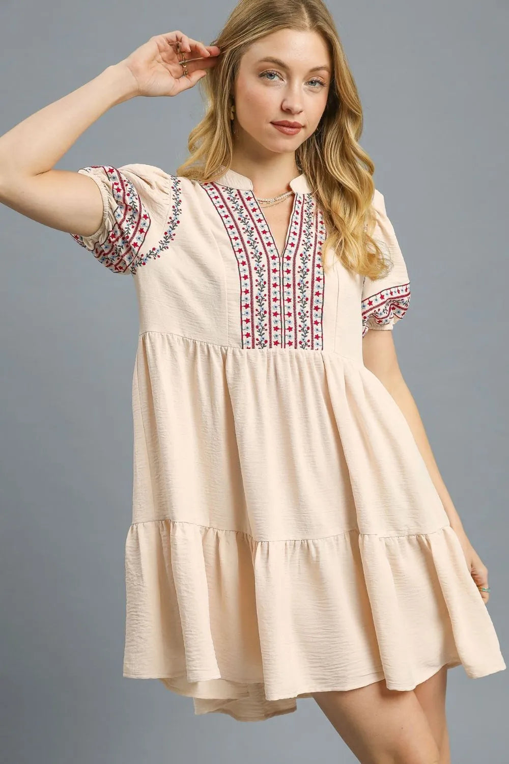 Tan Umgee floral trim puff sleeve mini dress with a fitted bodice and flowy skirt, styled for casual or semi-formal occasions.
