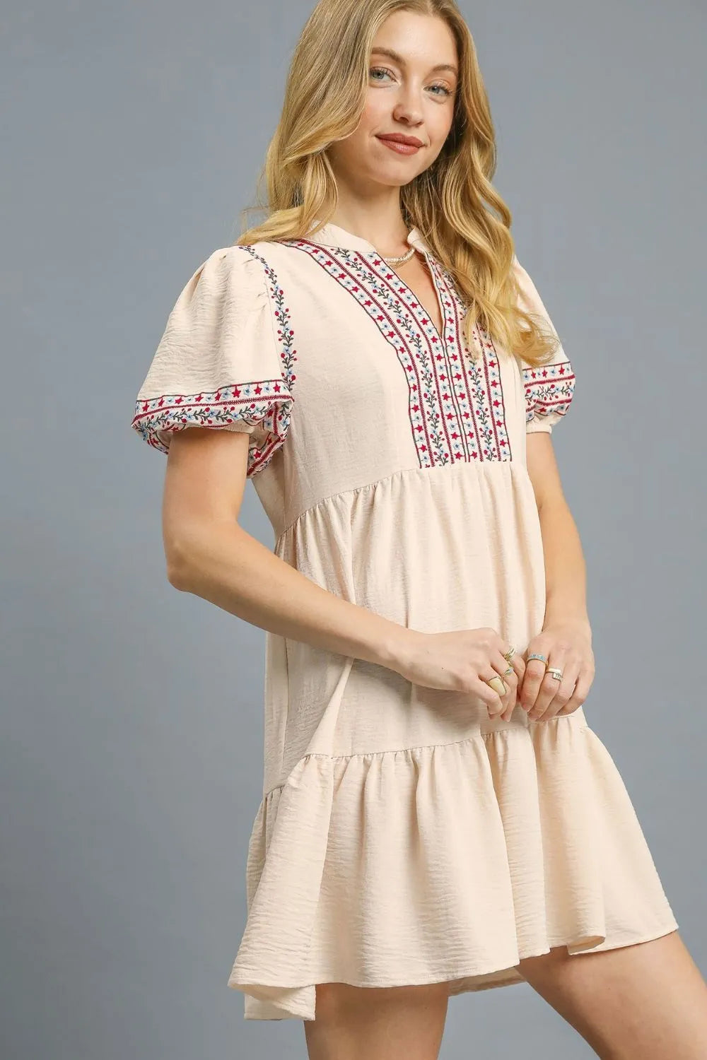 Tan Umgee floral trim puff sleeve mini dress with ruffled details and a fitted silhouette, perfect for casual or semi-formal wear.