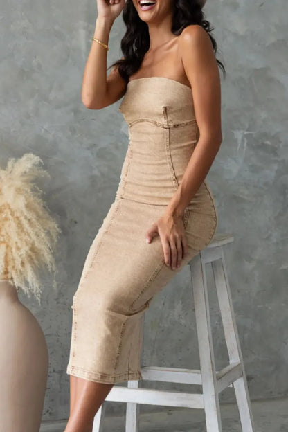 Washed tan slit-back tube denim dress by Trendsi featuring a fitted silhouette and stylish back slit detail.