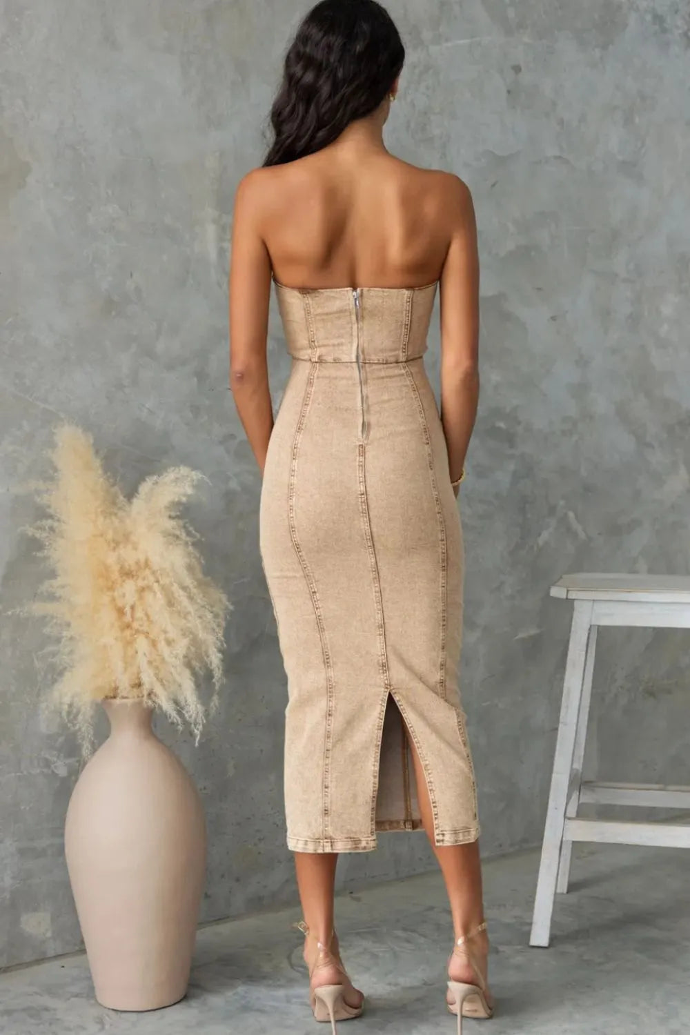 Washed tan slit-back tube denim dress by Trendsi, featuring a fitted silhouette and stylish back slit.