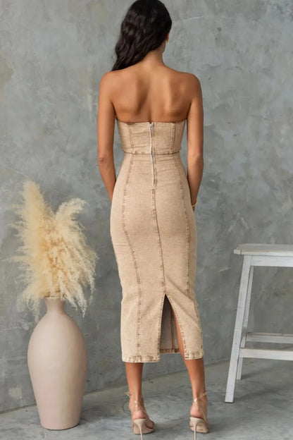 Washed tan slit-back tube denim dress by Trendsi, featuring a fitted silhouette and stylish back slit.