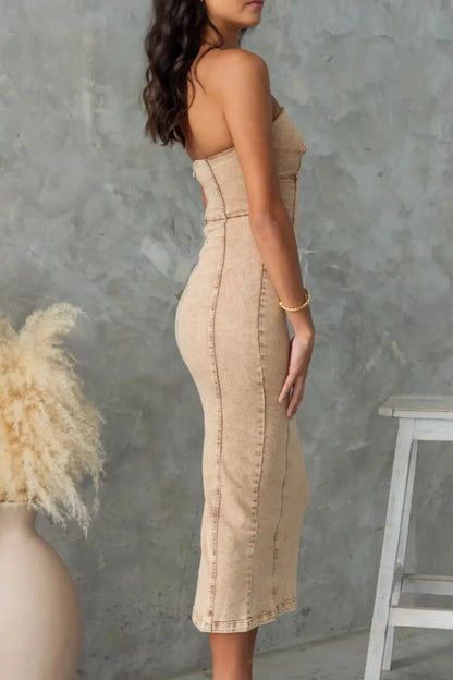 Tan washed slit-back tube denim dress by Trendsi, showcasing a fitted silhouette with a stylish back slit and sleeveless design.