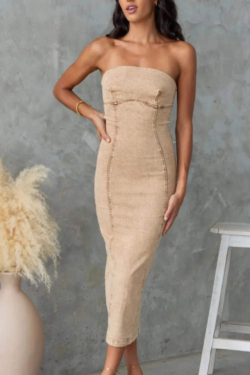 Washed tan slit-back tube denim dress by Trendsi, featuring a fitted silhouette and stylish back slit for a casual chic look.