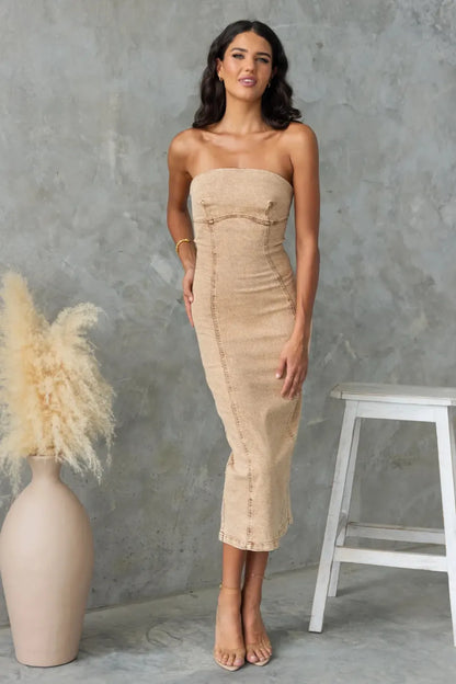 Tan washed slit-back tube denim dress by Trendsi, featuring a fitted silhouette and stylish back slit detail.