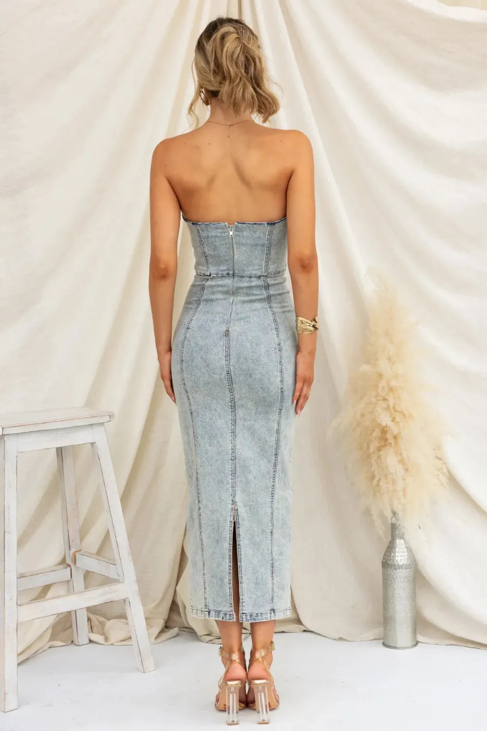 Washed tan slit-back tube denim dress by Trendsi featuring a fitted silhouette and stylish back slit design.