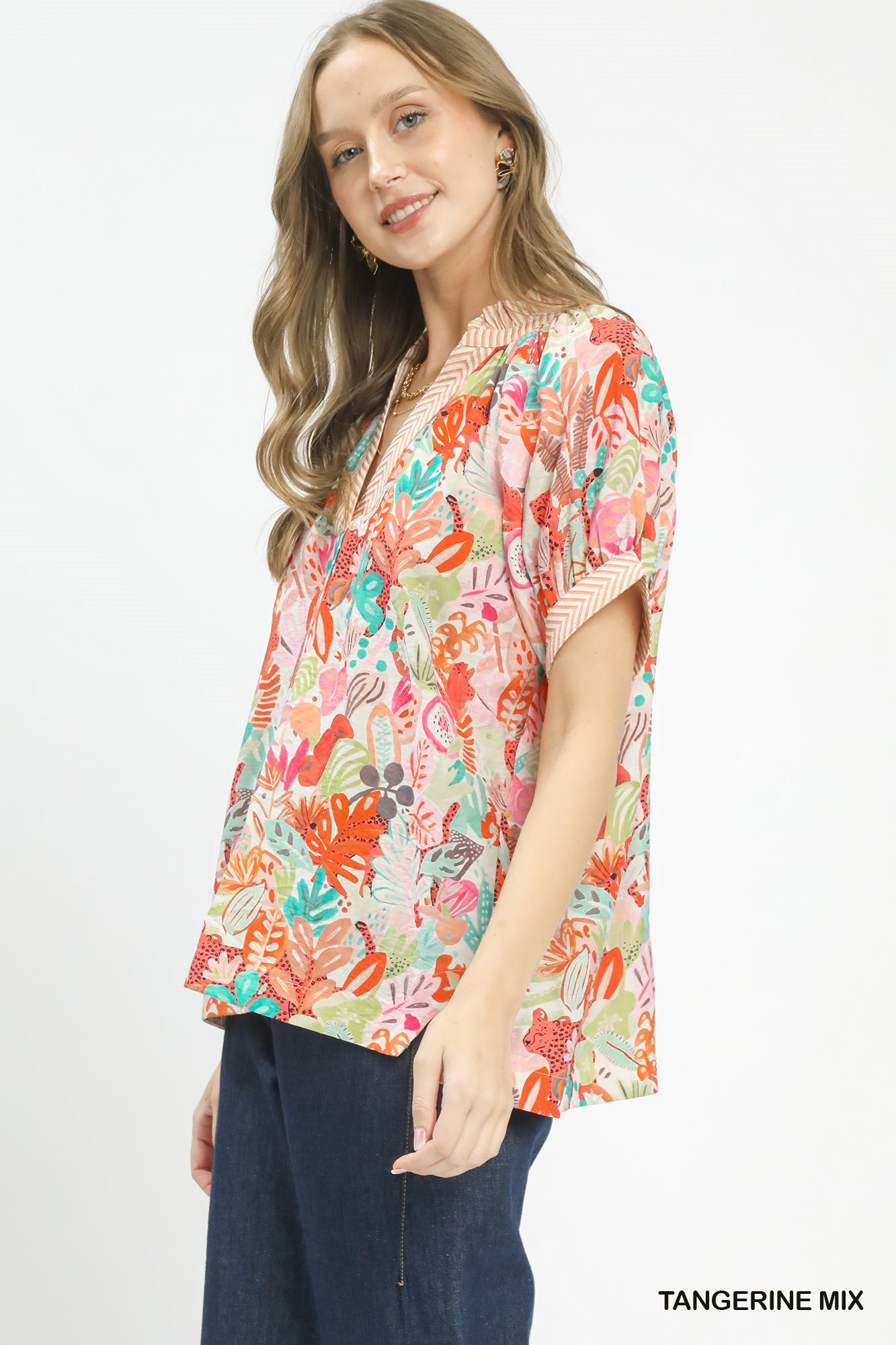 Umgee Mix Boho printed V-neck top with orange and neutral patterns, casual fit, lightweight fabric, and relaxed style.