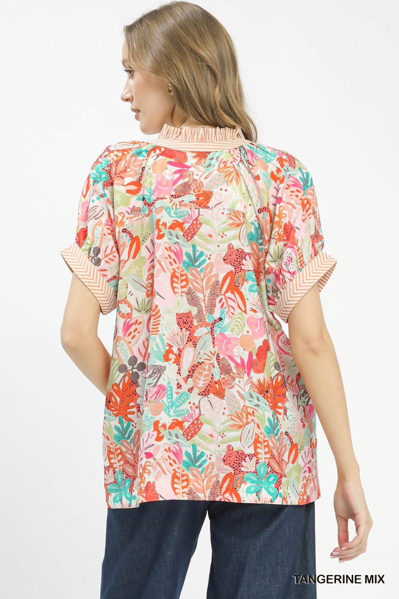 Umgee Mix Boho printed v-neck top with orange and white pattern, casual fit, lightweight fabric, and bohemian style.