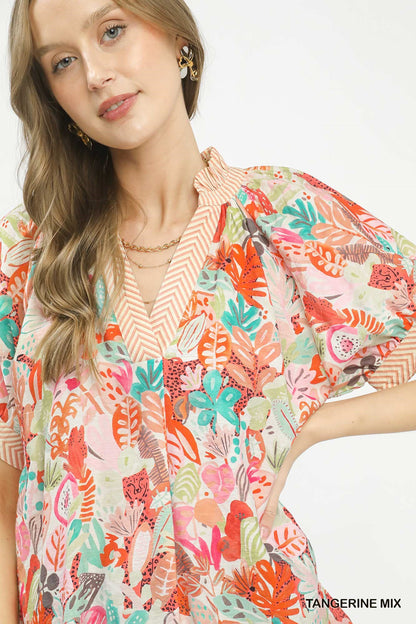 Tangerine Umgee Mix Boho printed V-neck top with relaxed fit and floral pattern, styled for casual or boho outfits.