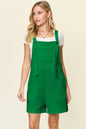 Tangerine Trendsi Double Take full-size sleeveless textured romper with a fitted silhouette and sleeveless design.
