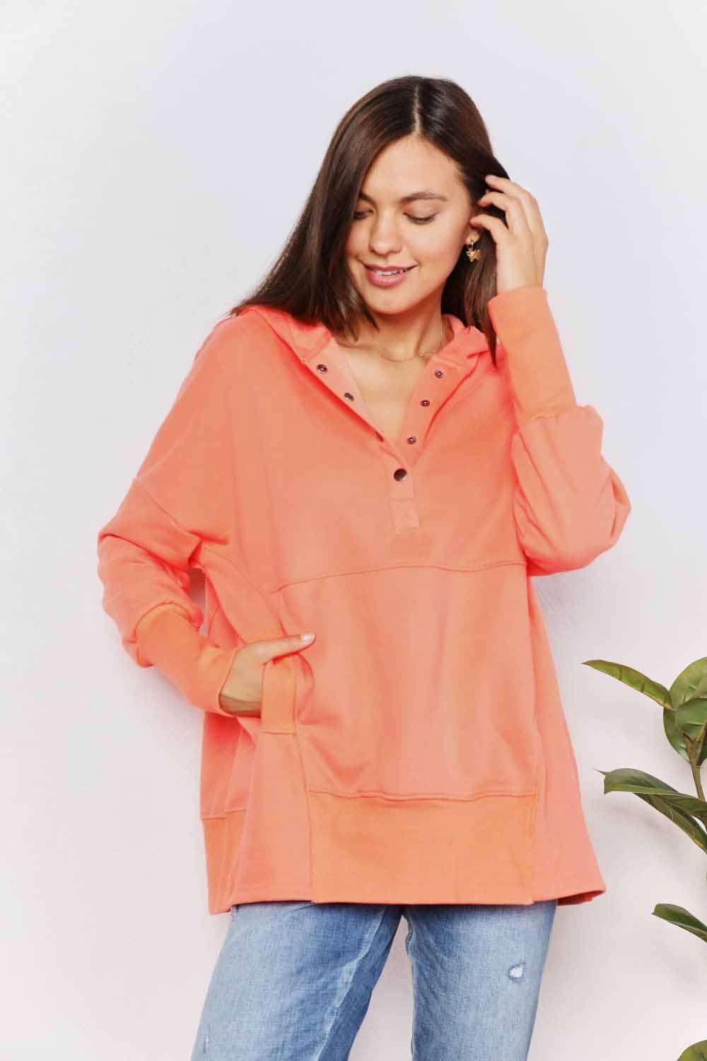 Tangerine double take quarter-snap dropped shoulder hoodie by Trendsi, featuring a relaxed fit and casual style.