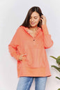 Tangerine double take quarter-snap dropped shoulder hoodie by Trendsi, featuring a relaxed fit and casual style.
