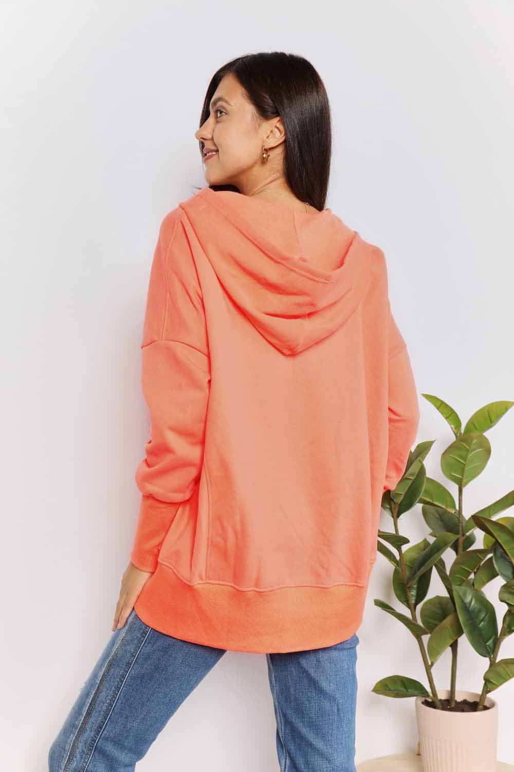 Tangerine double take quarter-snap dropped shoulder hoodie from Trendsi with relaxed fit and casual style.