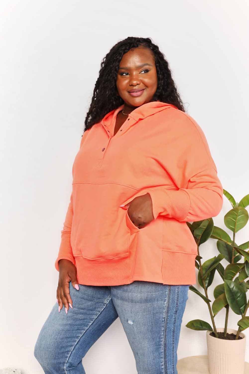 Tangerine Trendsi Double Take quarter-snap dropped shoulder hoodie with relaxed fit and casual style.