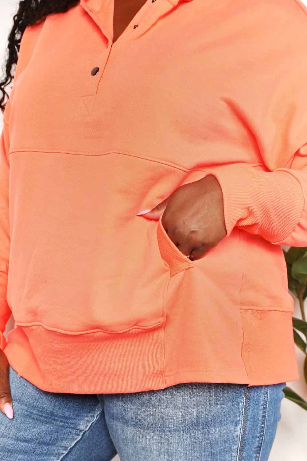 Tangerine Trendsi Double Take quarter-snap dropped shoulder hoodie with relaxed fit and front pocket.