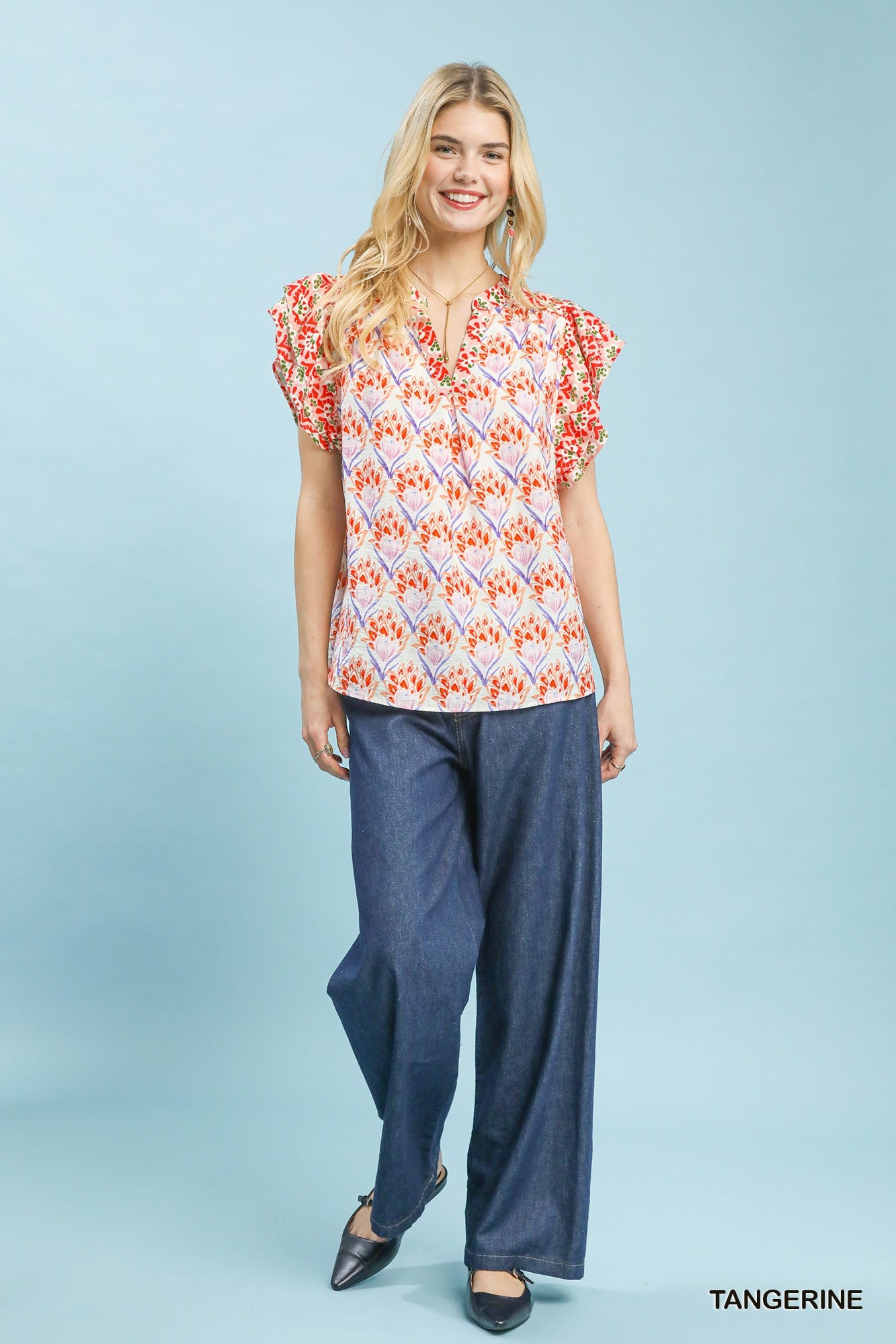 Orange floral blouse with double frill sleeves from Umgee, featuring a feminine and stylish design.