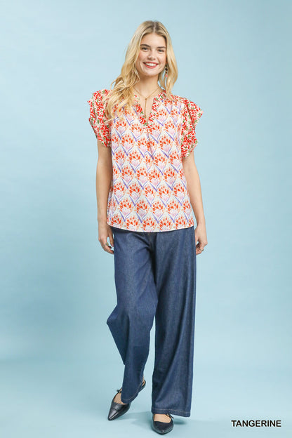 Orange floral blouse with double frill sleeves from Umgee, featuring a feminine and stylish design.