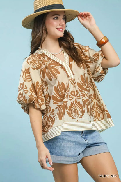 Taupe Umgee printed puff sleeve top with contrast trim, featuring a mixed pattern and stylish design, perfect for casual wear.